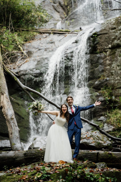Kari and Robert in wedding gown at waterfall